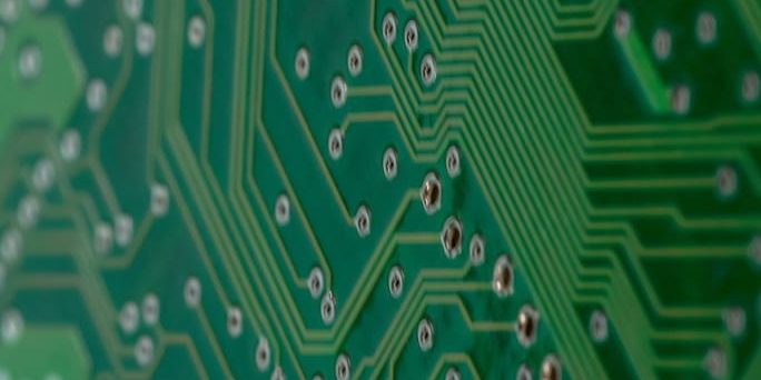 A Green Color Circuit Board With Close Up Shot